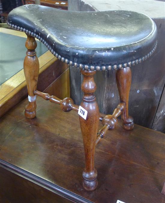 Saddle shape stool with leather top